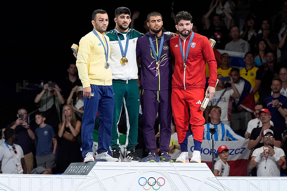 | Photo: AP/Eugene Hoshiko : Paris Olympics men's Greco-Roman 67kg wrestling: Ukraine's Parviz Nasibov, silver, Iran's Saeid Esmaeili Leivesi, gold, Azerbaijan's Hasrat Jafarov, Cuba's Luis Alberto Orta Sanchez, bronze